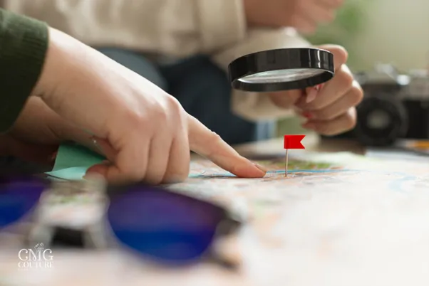 Individual using a red marker to highlight a location on a map, emphasizing local SEO strategies for small businesses