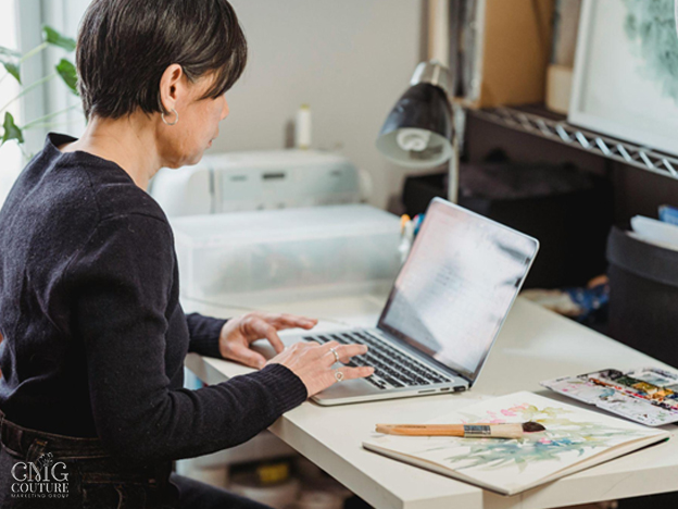 Woman working on laptop while planning marketing strategy